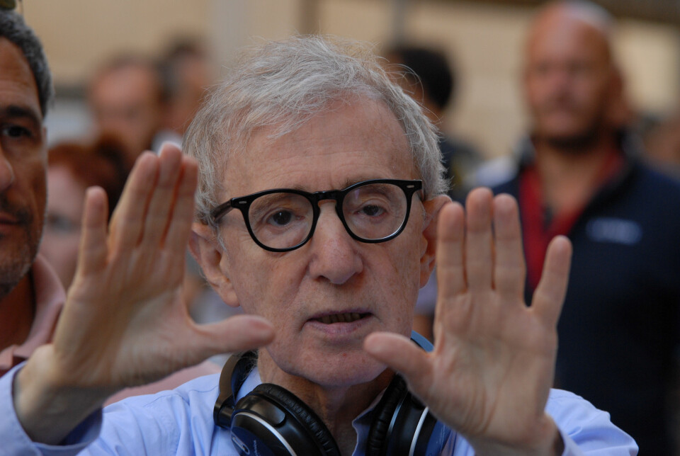 Film director Woody Allen holds his hands up as he directs the movie To Rome with Love