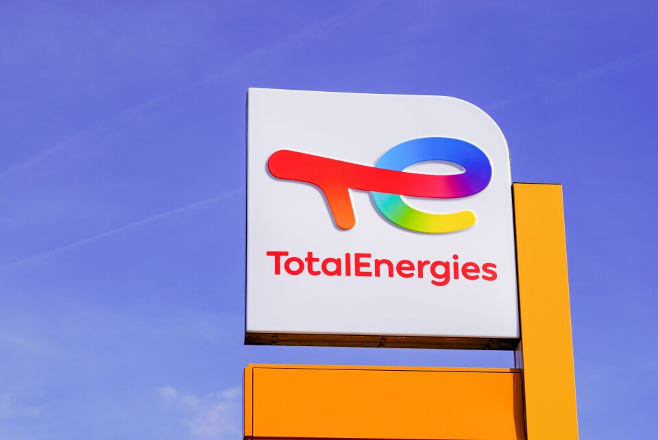 A TotalEnergies logo sign against blue sky