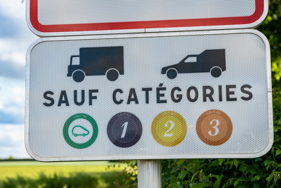 A view of a low-emission zone sign next to a road in France