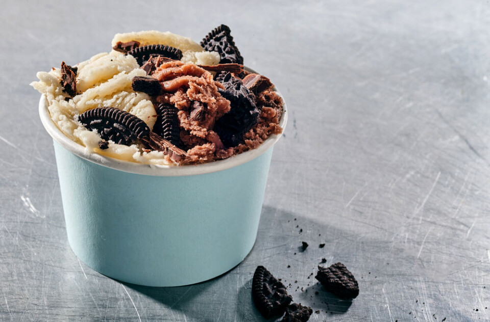 A photo of a pot of ice cream with cookies embedded in the top