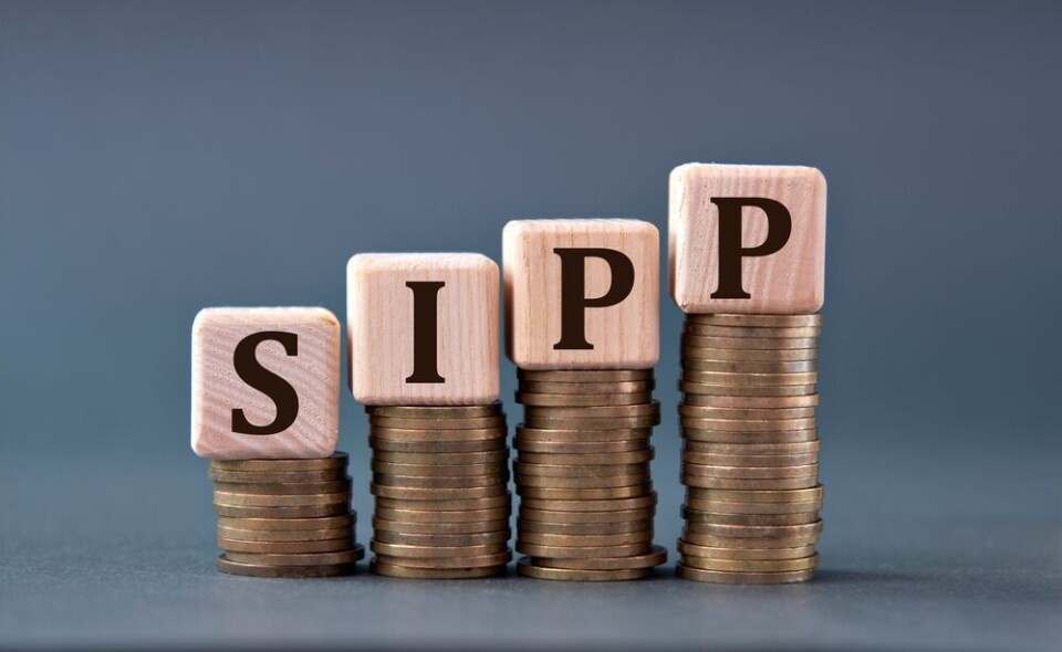 the letters SIPP balanced on coins