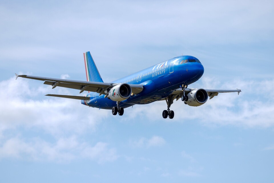 An ITA Airways plane flying in the sky