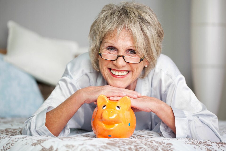 Older woman with a piggy bank