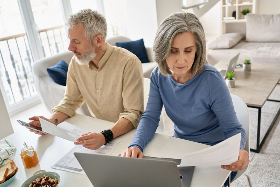 Older couple at desk looking at finances