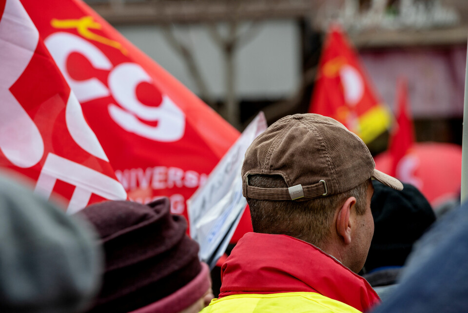 A photo of CGT union workers marching during a strike