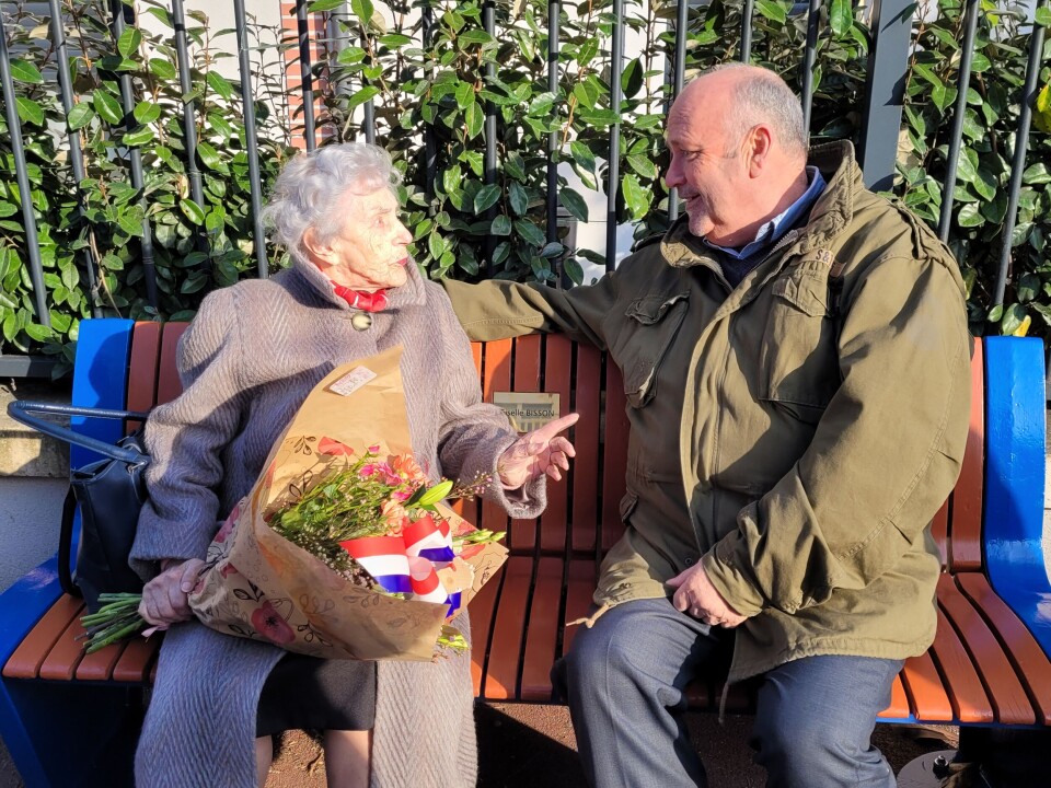 101-year-old Giselle Bisson and mayor Olivier Paz on bench