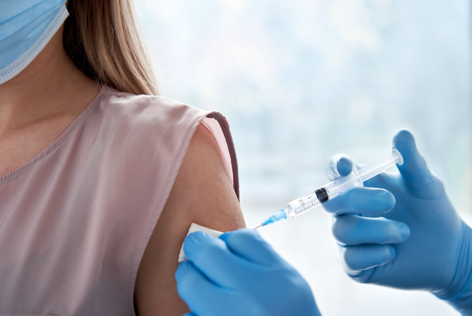 A woman receiving a vaccination