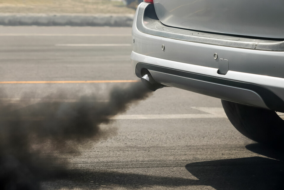 A photo of a car exhaust pumping out dark fumes
