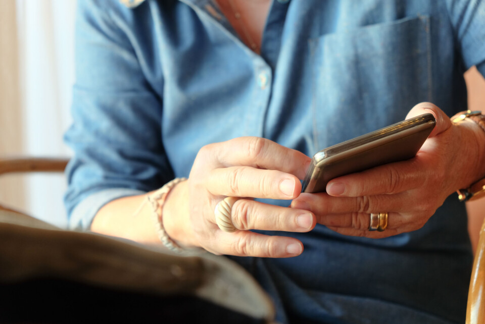 A woman using a smartphone close up