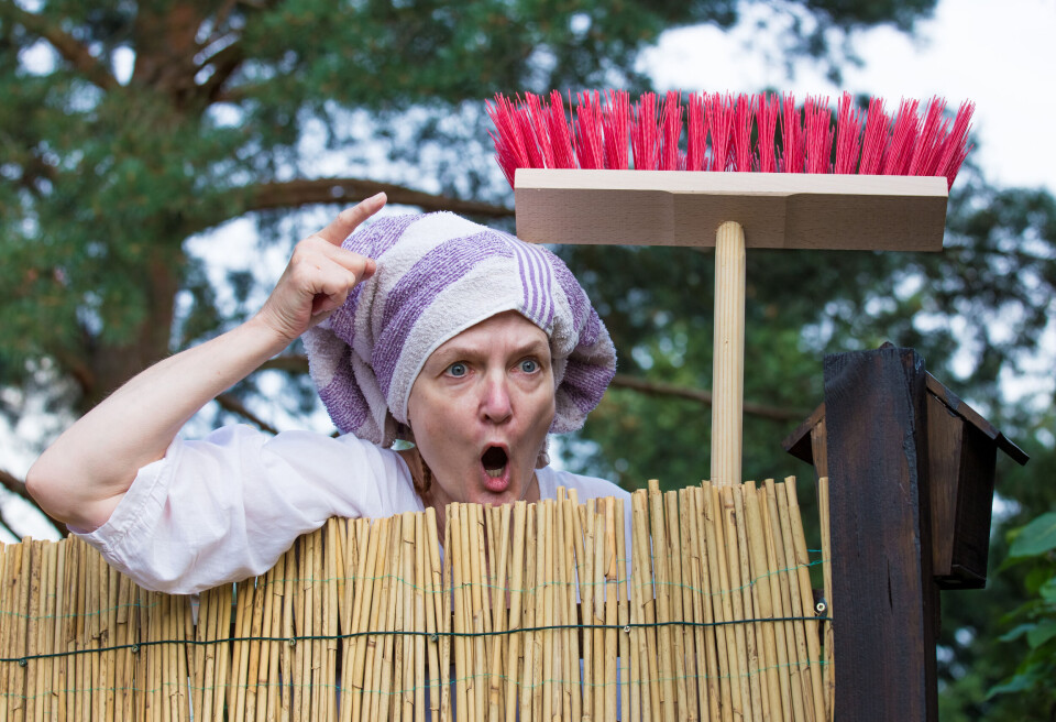 Angry woman shouting over fence