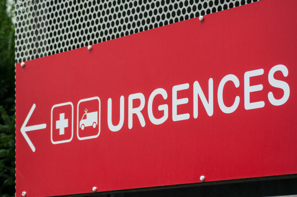 A red Urgences emergency hospital sign in French