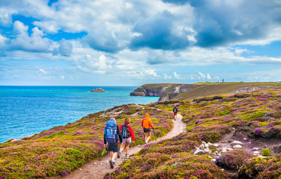 Hikers on the coast in Cap Frehel in Brittany