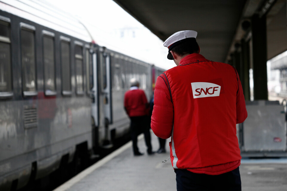 A photo of SNCF workers on a train platform