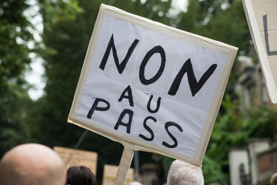 NeydtStock / Shutterstock An image of a placard used during protests against France's health and vaccine pass measures reading 'Non au pass' (No to the pass)