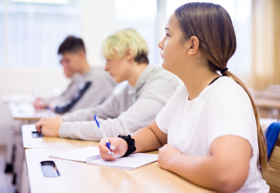 Girl in classroom working at desk