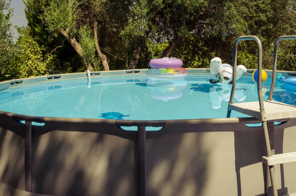 An above-ground pool in a garden