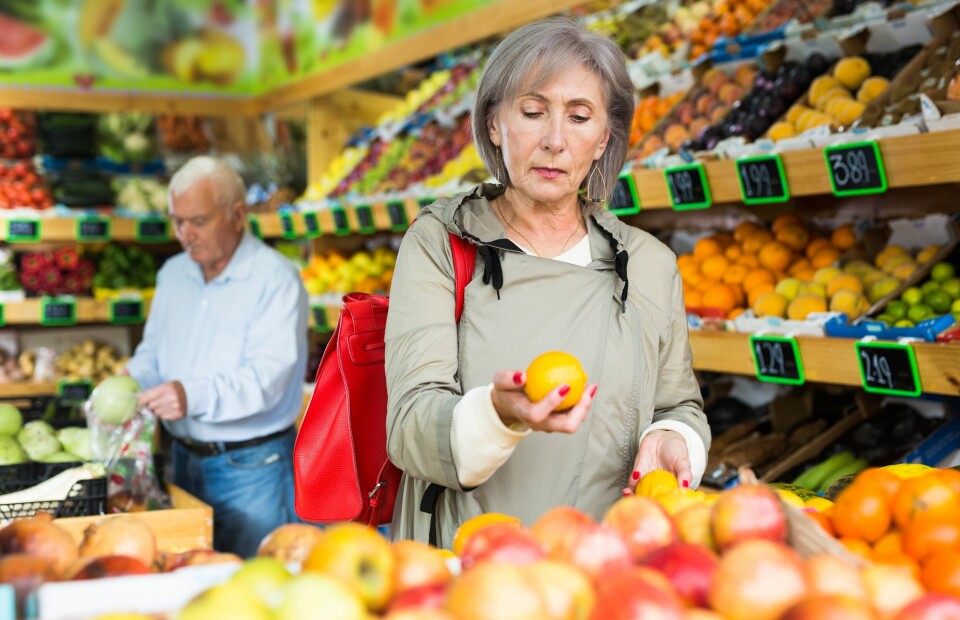 Older woman shopping for fruit in supermarket