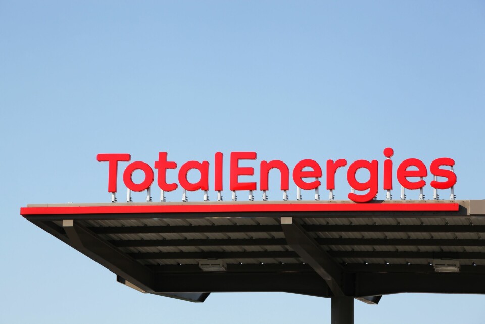 A photo of a TotalEnergies petrol station roof against blue sky
