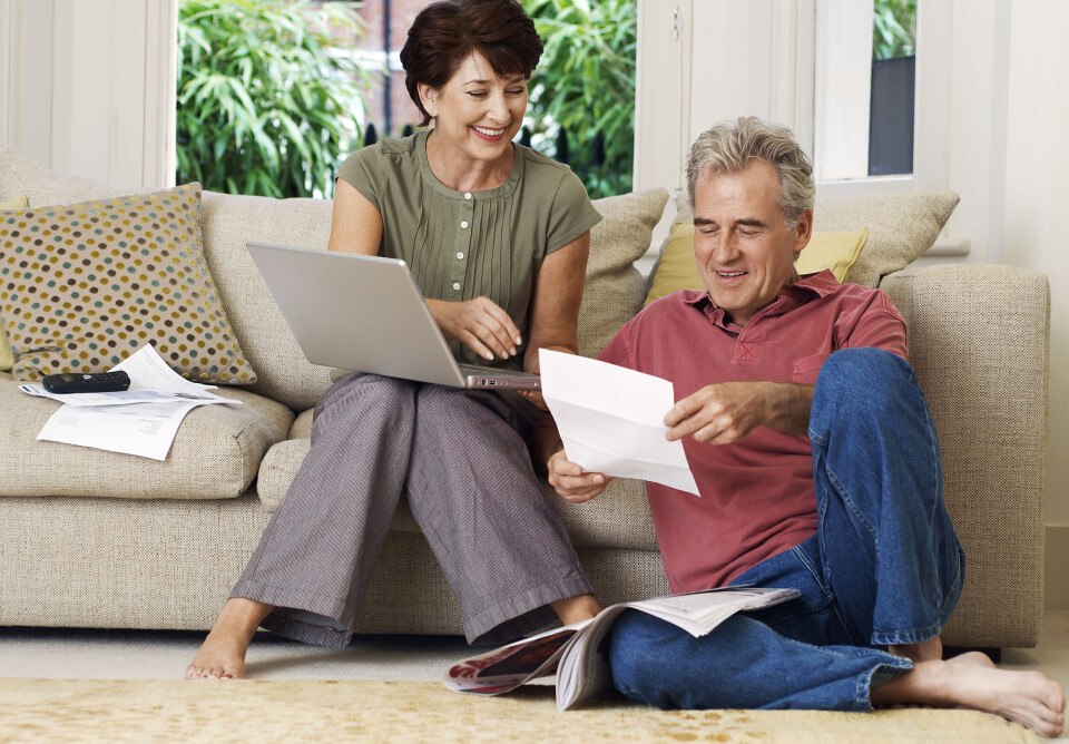 Middle aged couple looking at paperwork