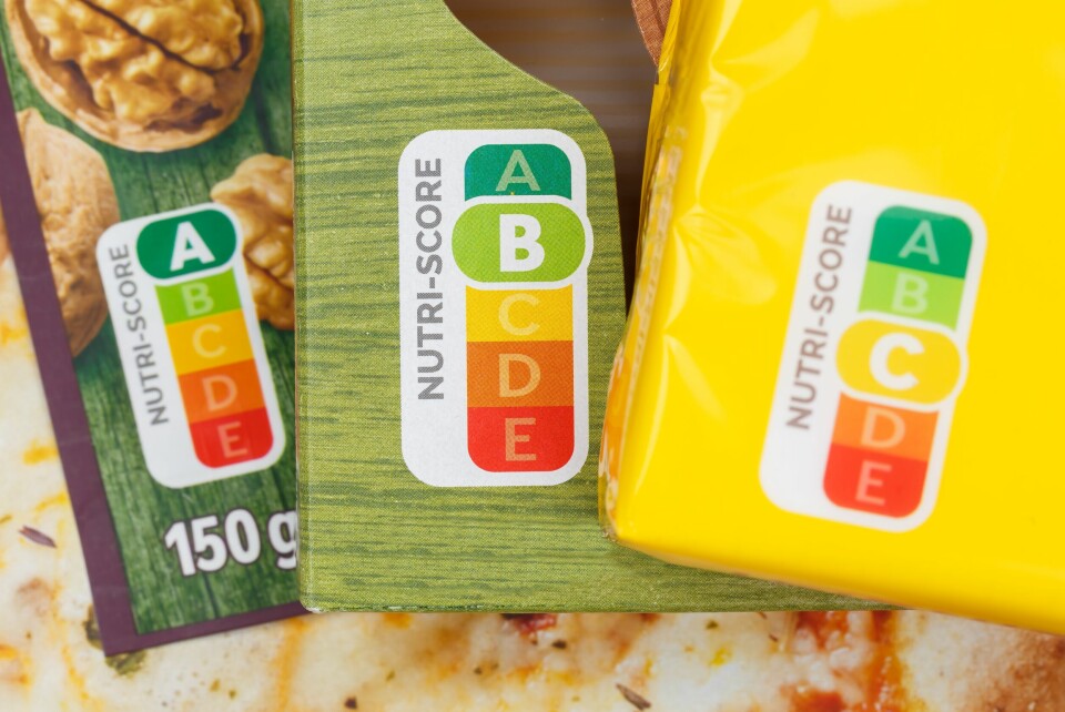 A photo of three food product boxes with different Nutri-Scores displayed