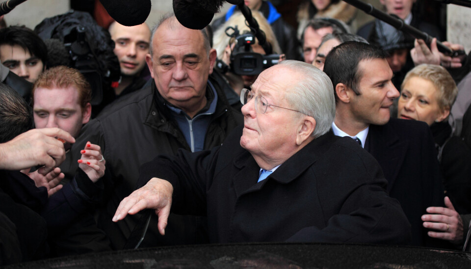 A view of Jean-Marie Le Pen surrounded by crowds after a press conference in 2012