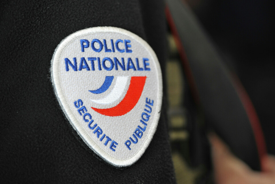 A photo of a Police Nationale logo on the sleeve of a police officer’s shirt