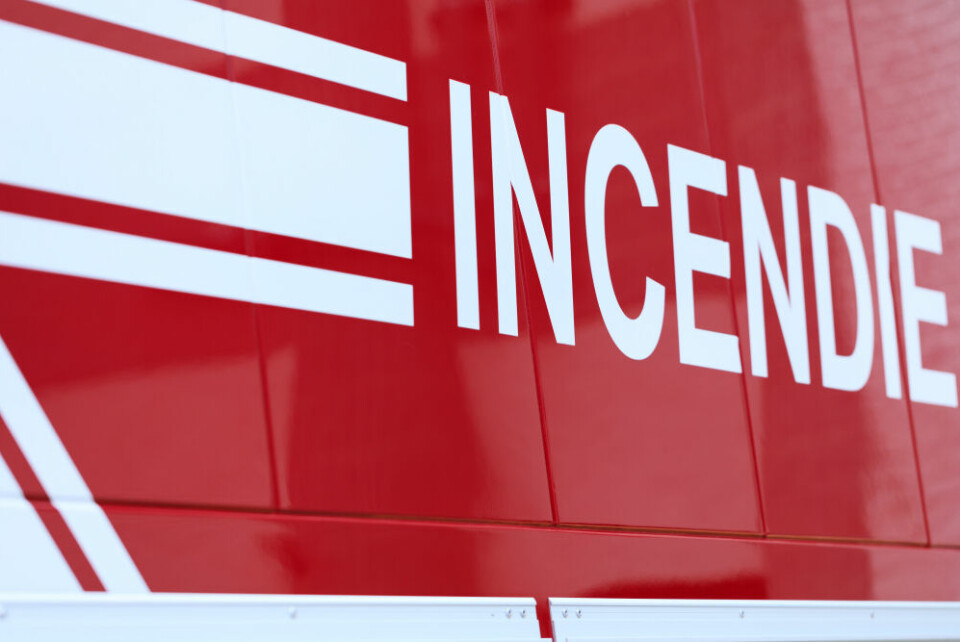 A fire engine reading ‘Incendie’ on the side