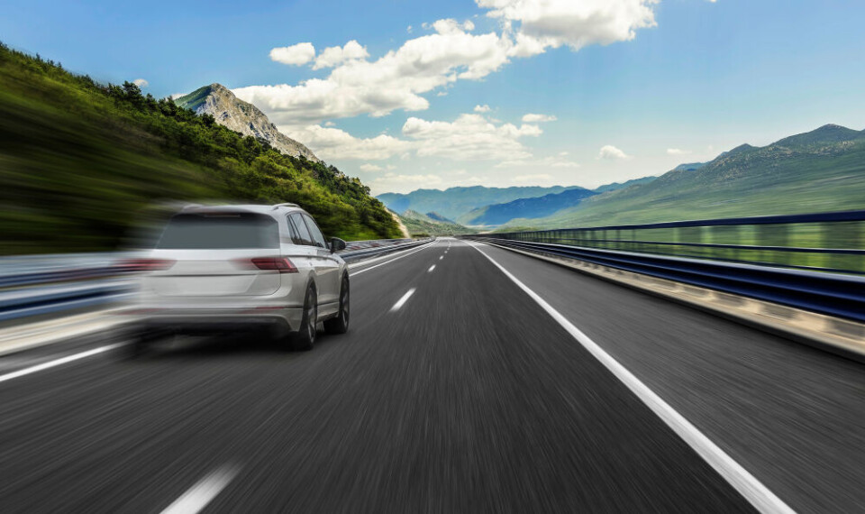 A car going fast along a motorway road