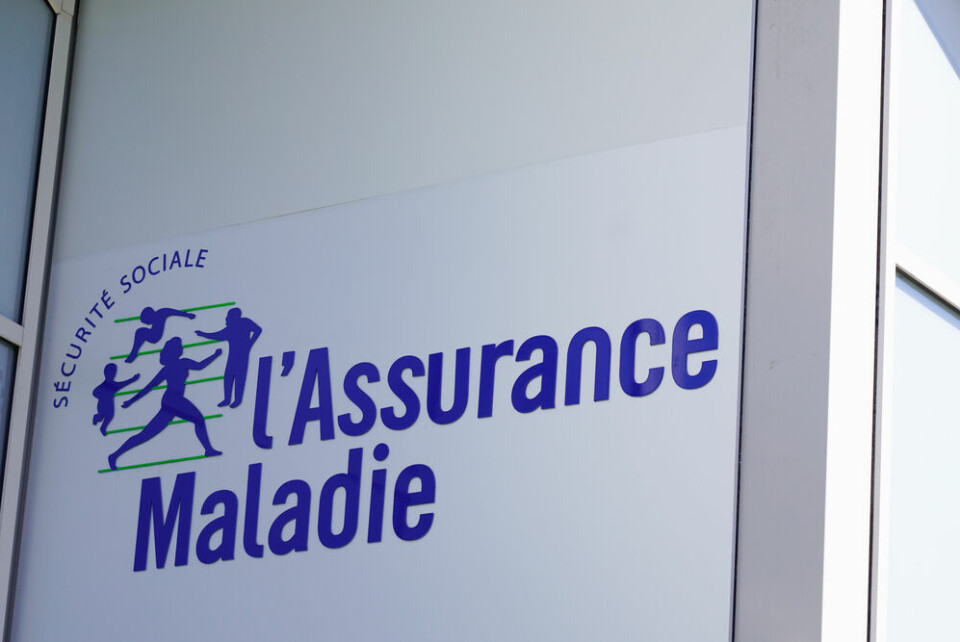 The Assurance maladie logo on a building sign in France