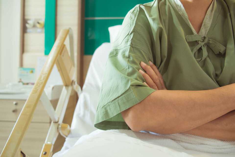 gappic / Shutterstock A female patient in a hospital bed crossing her arms in anger