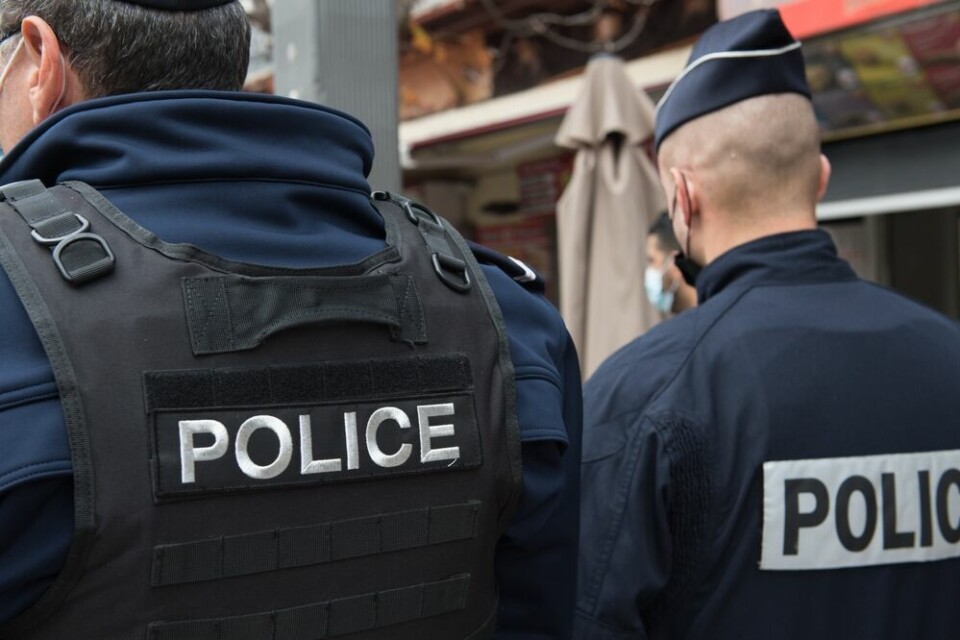 Two men wearing police uniforms in France