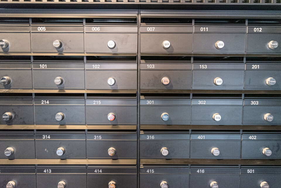 A view of a building’s locked letterboxes