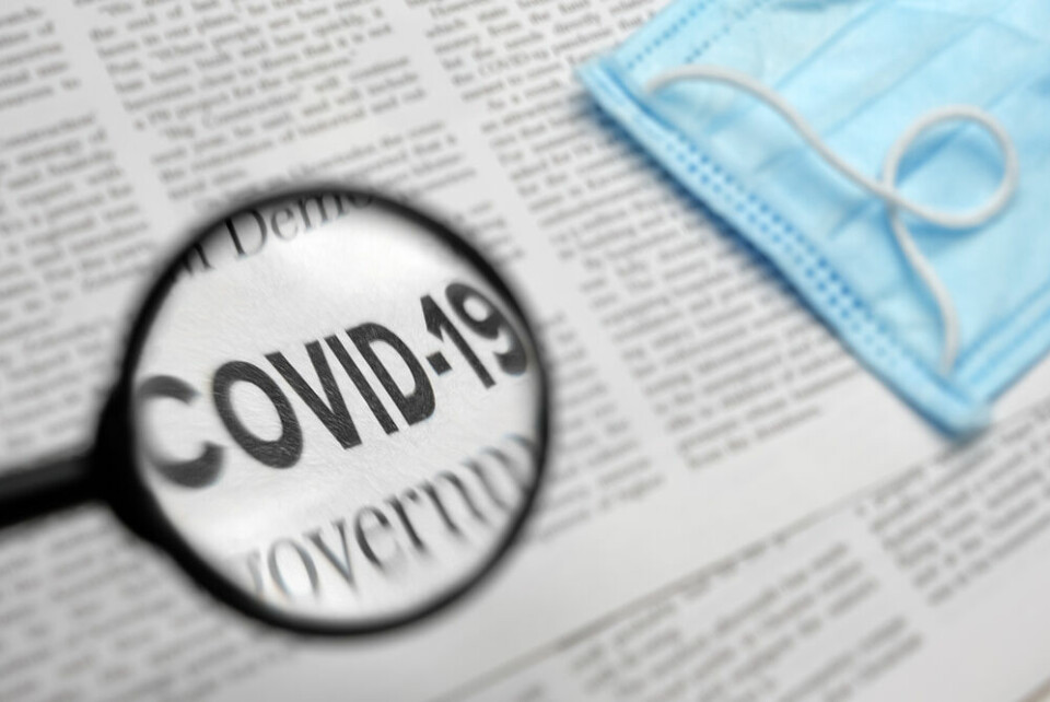 A magnifying glass over the word Covid-19
