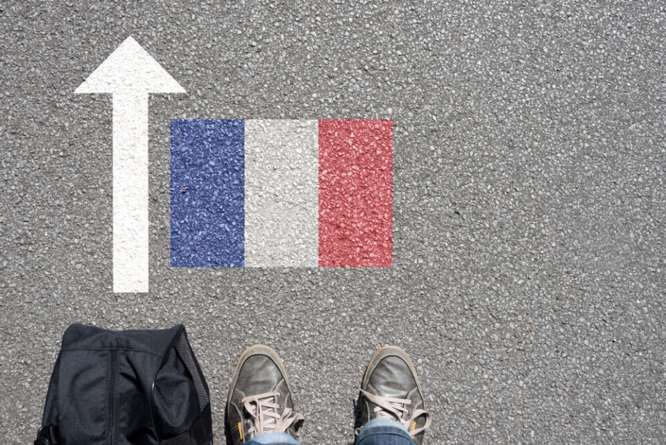 Bartolomiej Pietrzyk / Shutterstock A view of a man with a bag looking down to the floor with an arrow pointing towards a French flag to suggest access to France