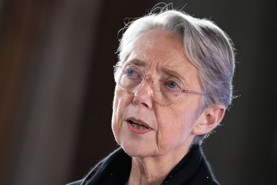 Frederic Legrand - COMEO / Shutterstock A view of Elisabeth Borne, prime minister of France, against a dark background