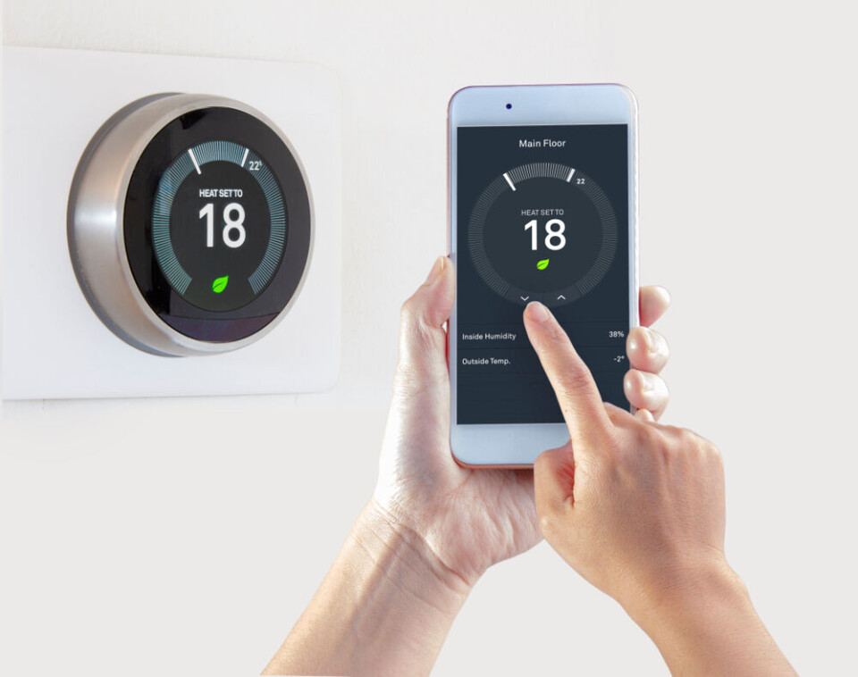 Oasisamuel / Shutterstock Someone adjusting a new thermostat in their home