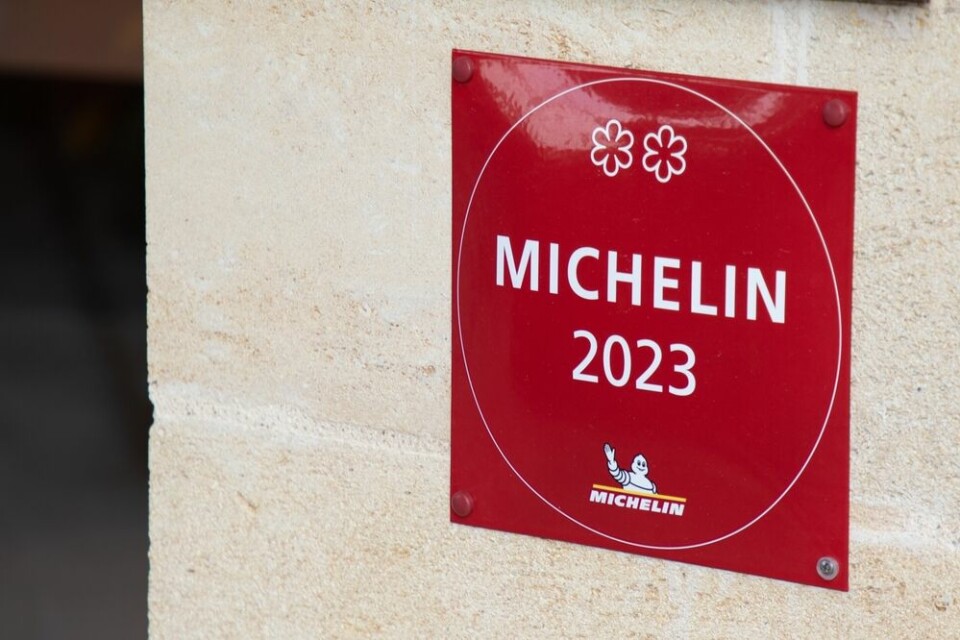 A view of a Michelin sign in the traditional red colours with two ‘Star’ restaurant symbols