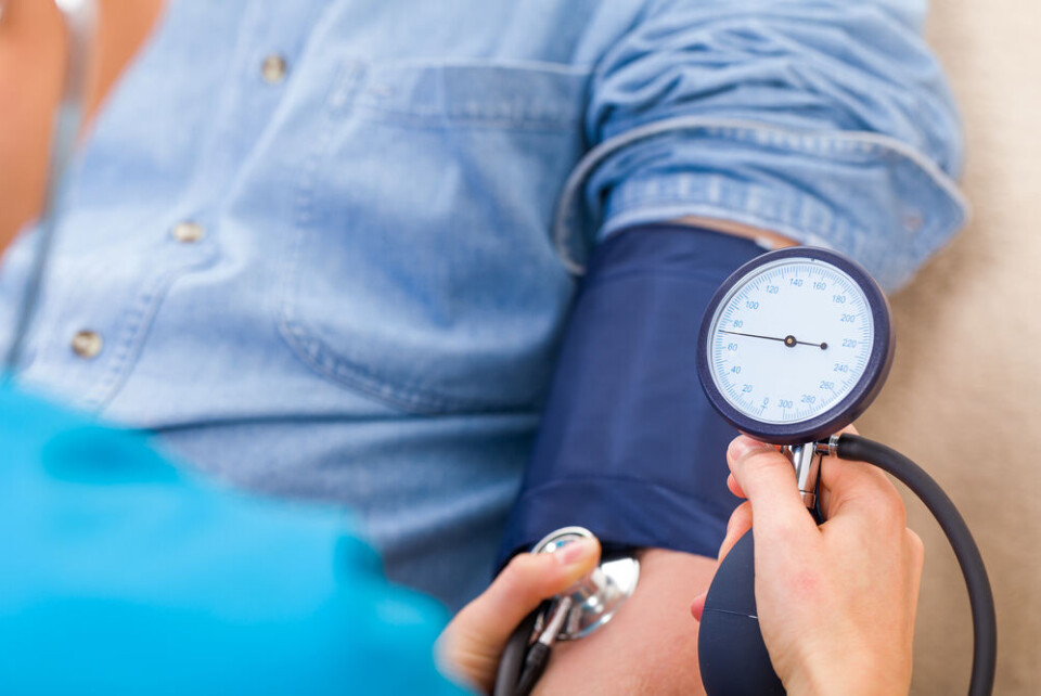 A man having his blood pressure checked at the doctor