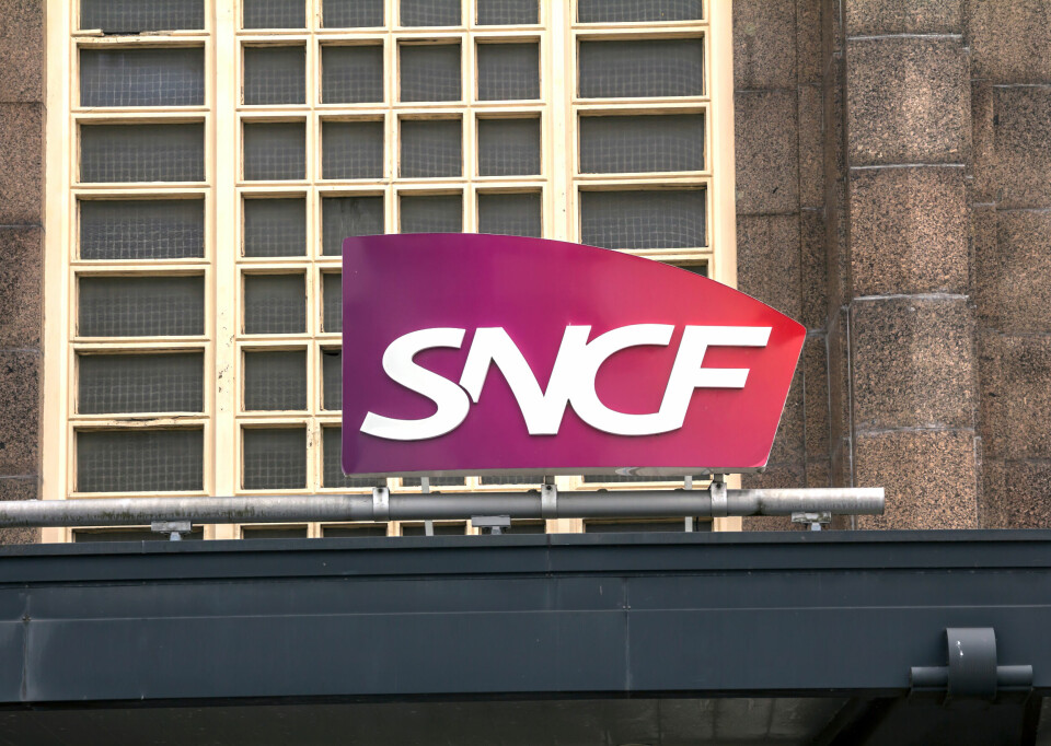 A photo of the SNCF logo on a building