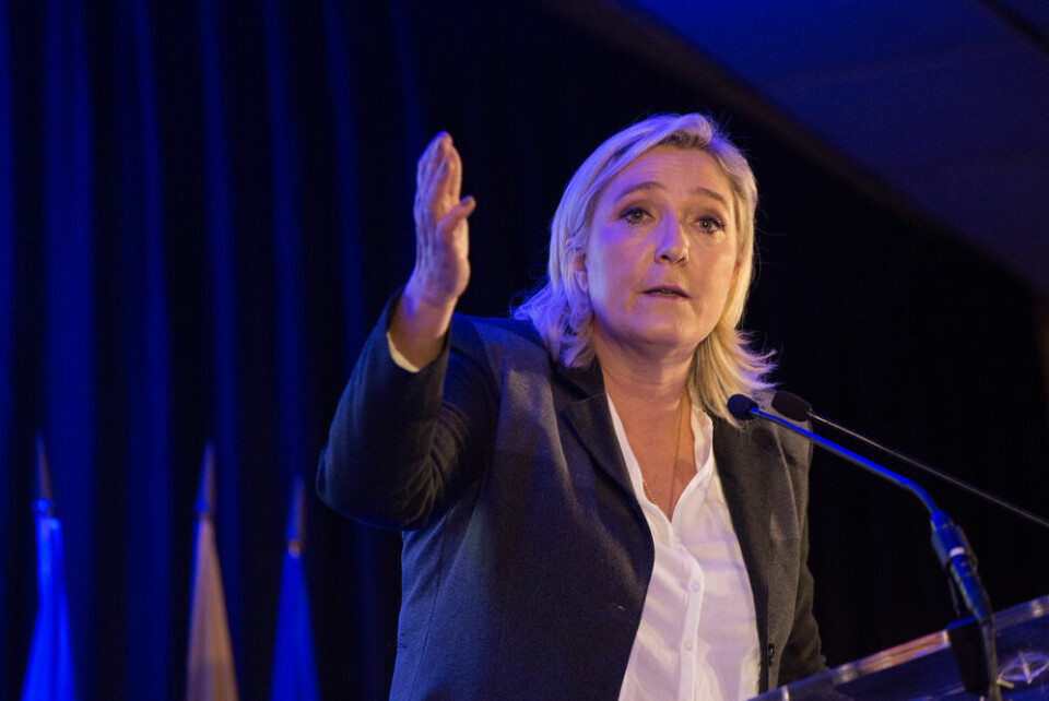 Marine Le Pen talks on stage