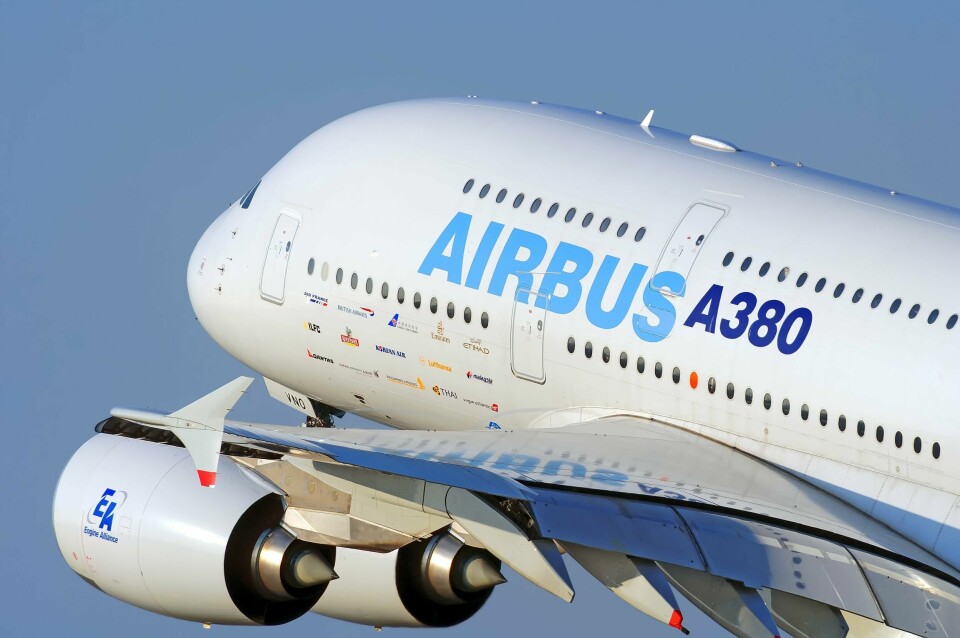 An Airbus A380 taking off with a close up of its fuselage