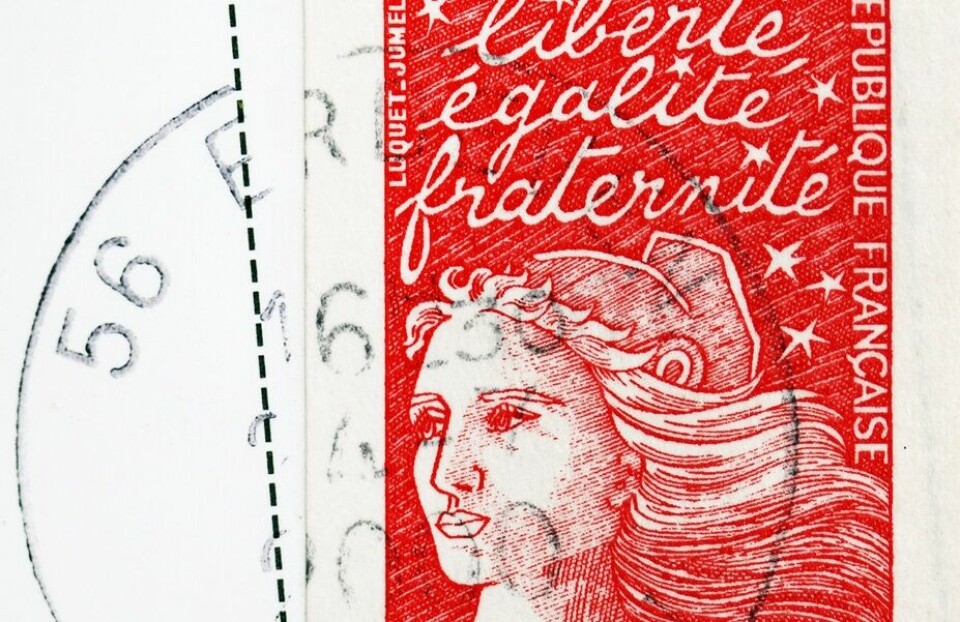 A close up image of a timbre rouge stamp from 2000