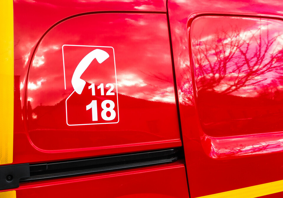 A close up of a pompiers vehicle with the number 112 and 18 on the side