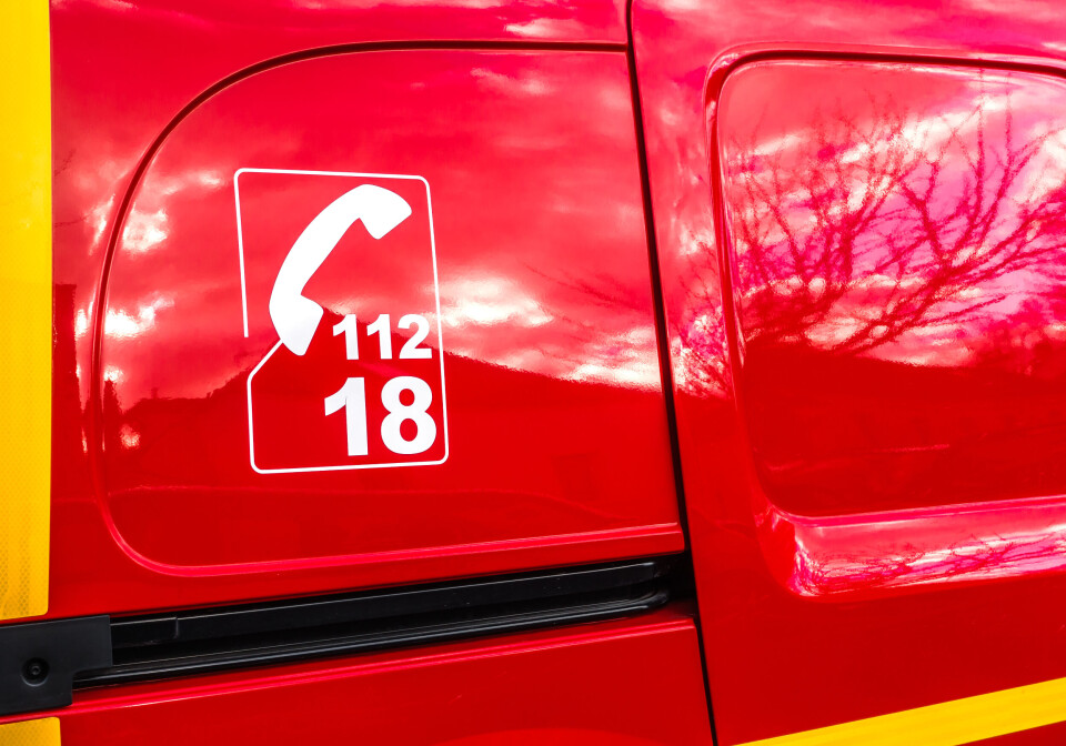 A close up of a pompiers vehicle with the number 112 and 18 on the side