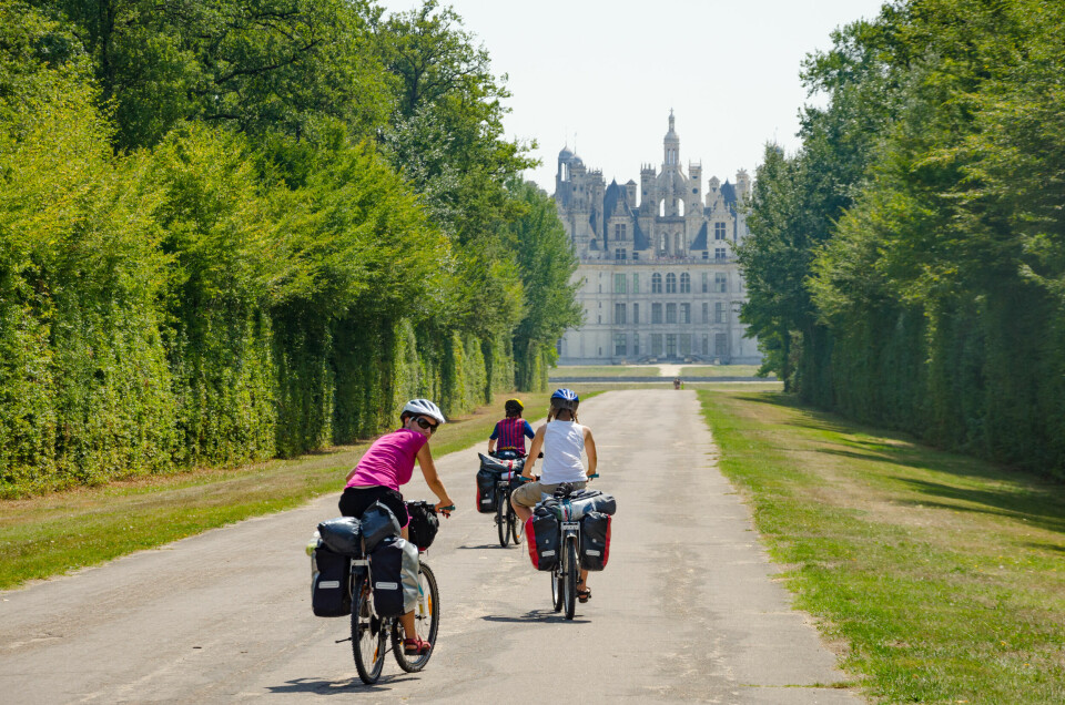 Cycling past Chambord Castle in the Loire Valley, France