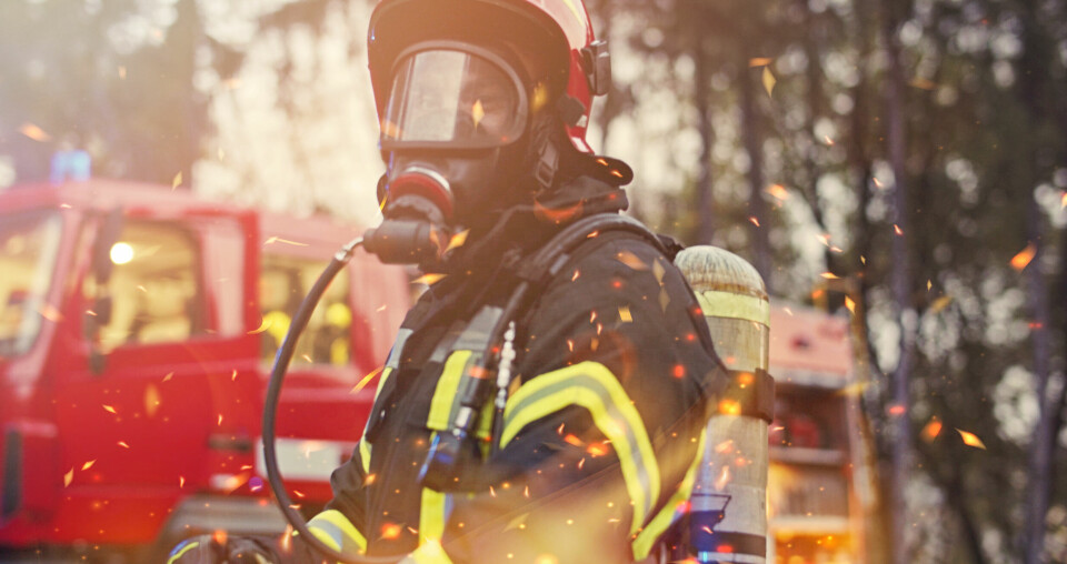 A firefighter in France wearing breathing equipment