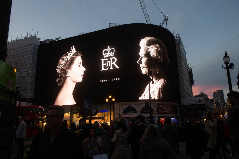 A photo of the screens at Piccadilly Circus in London lit up with a tribute to the late Queen Elizabeth II after her passing on September 8, 2022