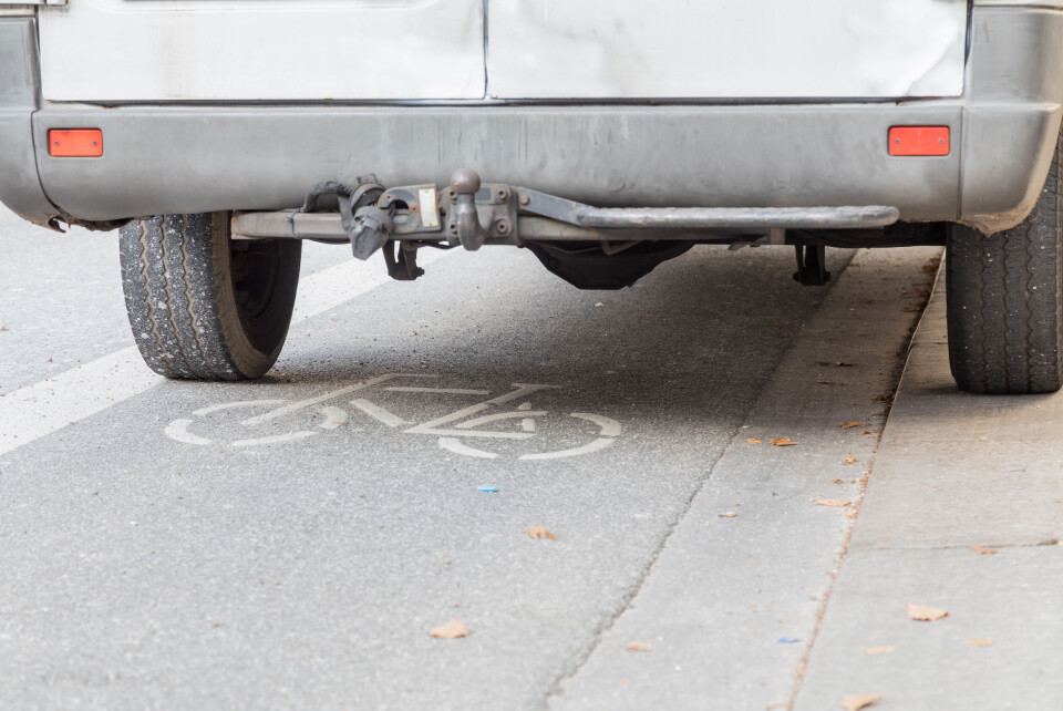 A delivery van parked across a road cycle lane