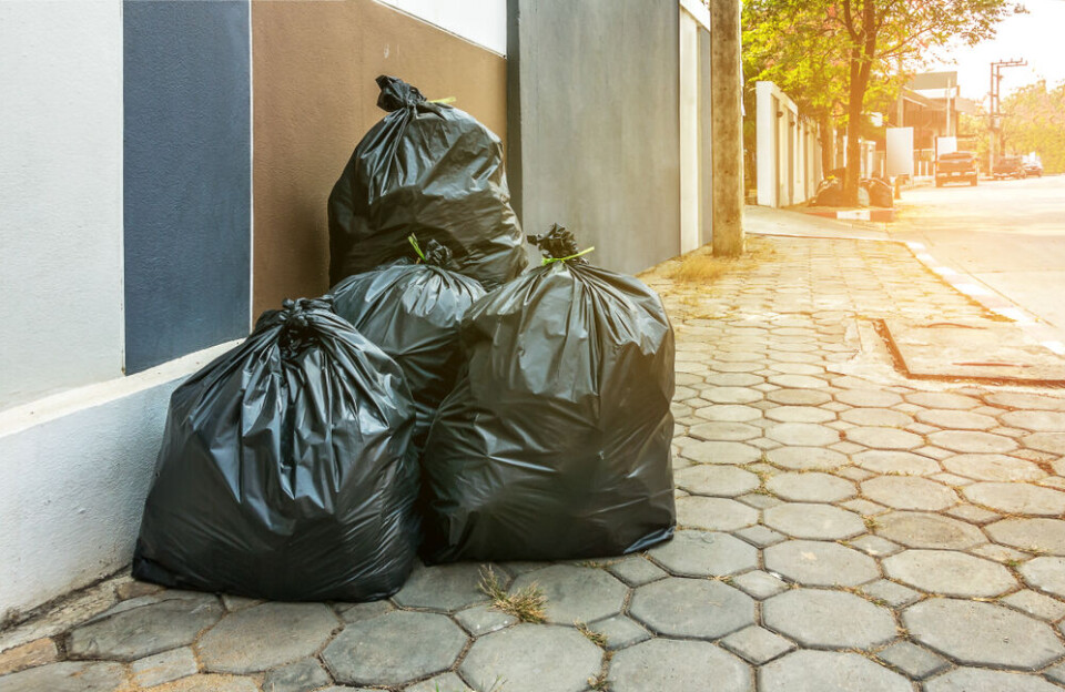 A pile of rubbish bags on a street