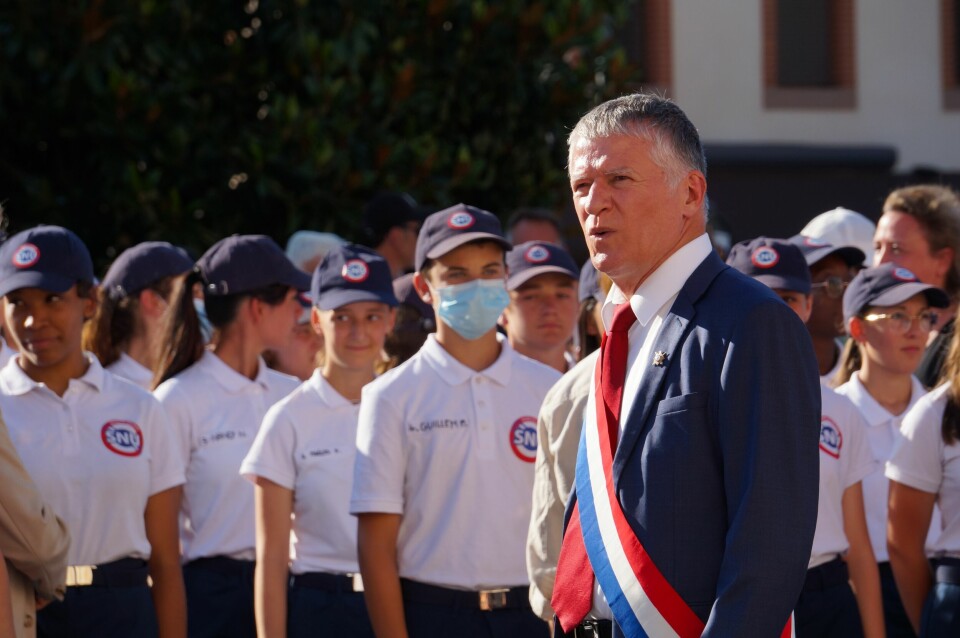 Senator Philippe Folliot greets the young volunteers of the Universal National Service (SNU), during the military parade of the Fête Nationale in 2022